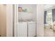 Convenient laundry area with washer and dryer units, next to another room at 2410 Dr Carver Rd, Charlotte, NC 28208