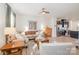 Open-concept living room and kitchen area with modern stainless steel appliances and lots of seating at 2410 Dr Carver Rd, Charlotte, NC 28208
