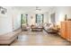 Bright living room features hardwood floors, a sectional couch, and neutral tones for a modern look at 2410 Dr Carver Rd, Charlotte, NC 28208