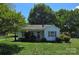 Charming single-story home with a cozy front porch and a spacious front yard at 2607 Lowell Rd, Gastonia, NC 28054