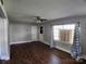 View of the spacious living room featuring wood flooring and a ceiling fan at 2607 Lowell Rd, Gastonia, NC 28054