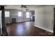 Open living room view featuring brick fireplace and access to the kitchen at 2607 Lowell Rd, Gastonia, NC 28054