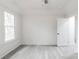Bright room featuring neutral walls, updated flooring, and great natural light at 2616 Holton Ave, Charlotte, NC 28208