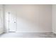 Bright room featuring neutral walls, updated flooring, and great natural light at 2616 Holton Ave, Charlotte, NC 28208