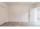 Well-lit bedroom with closet and access to other rooms in the home at 2616 Holton Ave, Charlotte, NC 28208