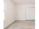 Bright room featuring neutral walls, updated flooring, and a spacious closet at 2616 Holton Ave, Charlotte, NC 28208