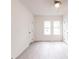 Sunlit bedroom boasts fresh paint, updated flooring, and a cooling ceiling fan at 2616 Holton Ave, Charlotte, NC 28208