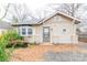 Charming bungalow-style home featuring a bay window, front door with glass, and a unique architectural details at 2616 Holton Ave, Charlotte, NC 28208