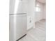 Bright kitchen area with modern refrigerator and access to additional storage at 2616 Holton Ave, Charlotte, NC 28208