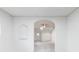 Bright and airy living room showcasing archways, neutral paint, light flooring, and decorative niche at 2616 Holton Ave, Charlotte, NC 28208