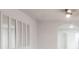 Bright living room with modern flooring, a decorative mirror, and archways leading to adjacent spaces at 2616 Holton Ave, Charlotte, NC 28208