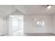 Bright living area features sleek gray floors, large mirror, modern lighting, and seamless flow to other rooms at 2616 Holton Ave, Charlotte, NC 28208