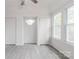 Sunlit living room features neutral walls, updated flooring, and great natural light at 2616 Holton Ave, Charlotte, NC 28208