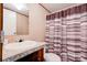 Cozy bathroom featuring granite countertop, modern faucet, and a striped shower curtain at 2923-1 G B Blanton Rd, Shelby, NC 28152