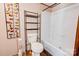 Bathroom showcasing modern shelving, toilet, and tub/shower with white surround at 2923-1 G B Blanton Rd, Shelby, NC 28152