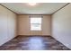 Bright bedroom with wood-look flooring, a window letting in natural light, and neutral wall color at 2923-1 G B Blanton Rd, Shelby, NC 28152