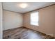 Bedroom with laminate flooring, neutral walls, and bright natural light at 2923-1 G B Blanton Rd, Shelby, NC 28152