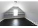 Finished attic with tile floor and built in shelving at 3010 Lakewood Edge Dr, Charlotte, NC 28269