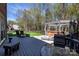 Spacious deck with seating areas, hot tub and lush yard at 3010 Lakewood Edge Dr, Charlotte, NC 28269