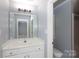 Bathroom with a modern vanity and large mirror at 3010 Lakewood Edge Dr, Charlotte, NC 28269