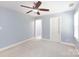 Neutral bedroom with ceiling fan, light blue walls and white trim at 3010 Lakewood Edge Dr, Charlotte, NC 28269