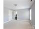 Spacious bedroom features a large window and neutral carpet at 3010 Lakewood Edge Dr, Charlotte, NC 28269