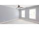 Bright bedroom with two large windows and neutral-colored walls and carpet at 3010 Lakewood Edge Dr, Charlotte, NC 28269