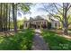 Attractive home with a well-manicured lawn and beautiful landscaping at 3010 Lakewood Edge Dr, Charlotte, NC 28269