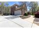Beautiful two-story brick home with mature trees at 3010 Lakewood Edge Dr, Charlotte, NC 28269