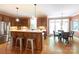 Open concept kitchen featuring wood cabinets, stainless steel appliances and an island with barstool seating at 3010 Lakewood Edge Dr, Charlotte, NC 28269