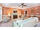 Comfortable living room with fireplace, soft seating, and access to the bar at 3010 Lakewood Edge Dr, Charlotte, NC 28269