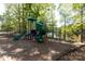 Community playground with slides and climbing structures surrounded by mature trees at 3010 Lakewood Edge Dr, Charlotte, NC 28269