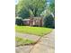 Charming one-story red brick home with a well-maintained front yard and inviting entryway at 3507 Rogers St, Charlotte, NC 28208
