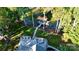 A bird's-eye view reveals a backyard oasis, featuring a stone patio, lush lawn, and tranquil lake access at 3915 Chevlot Hills Rd, Sherrills Ford, NC 28673