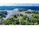 A scenic aerial view of a waterfront property with lush greenery and a peaceful lake setting at 3915 Chevlot Hills Rd, Sherrills Ford, NC 28673