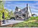 Backyard view featuring a patio, deck, and stairs, blending seamlessly with the natural landscape at 3915 Chevlot Hills Rd, Sherrills Ford, NC 28673