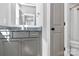 Modern bathroom with granite countertops, gray cabinetry, and a shower; elegance and functionality combined at 3915 Chevlot Hills Rd, Sherrills Ford, NC 28673