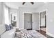 Relaxing bedroom with white walls, hardwood floors, and a view of a bathroom and closet at 3915 Chevlot Hills Rd, Sherrills Ford, NC 28673