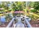 Wooden staircase leading to a boat dock with several boats and covered gazebo on the lake at 3915 Chevlot Hills Rd, Sherrills Ford, NC 28673