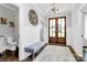 Elegant entryway with hardwood floors, a stylish bench, and a charming wooden front door at 3915 Chevlot Hills Rd, Sherrills Ford, NC 28673