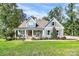 Charming exterior of a two-story home with a welcoming front porch and manicured lawn at 3915 Chevlot Hills Rd, Sherrills Ford, NC 28673
