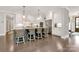 Spacious kitchen featuring a large island, white cabinets, stainless steel appliances, and a hardwood floor at 3915 Chevlot Hills Rd, Sherrills Ford, NC 28673