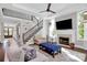 Inviting living room features a fireplace, soaring ceiling, staircase and plenty of natural light at 3915 Chevlot Hills Rd, Sherrills Ford, NC 28673