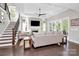 Spacious living room with fireplace, hardwood floors, staircase and plenty of natural light at 3915 Chevlot Hills Rd, Sherrills Ford, NC 28673