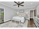 Elegant main bedroom features a plush bed with decorative pillows, a ceiling fan, and stylish furnishings at 3915 Chevlot Hills Rd, Sherrills Ford, NC 28673