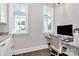 Bright home office featuring a built-in desk, granite counters, and natural light from large windows at 3915 Chevlot Hills Rd, Sherrills Ford, NC 28673