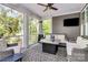 Inviting screened porch with comfortable seating, a fire table, and outdoor views, perfect for relaxation at 3915 Chevlot Hills Rd, Sherrills Ford, NC 28673