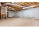 Unfinished basement with concrete floor and exposed ceiling, offering potential for customization at 4067 Old Buff Rd, Hickory, NC 28602