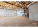 Spacious unfinished basement with concrete floor, exposed ceiling, and block walls for future expansion at 4067 Old Buff Rd, Hickory, NC 28602