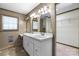 Bathroom showcasing double vanity with sinks, framed mirrors, and tile floors at 4067 Old Buff Rd, Hickory, NC 28602
